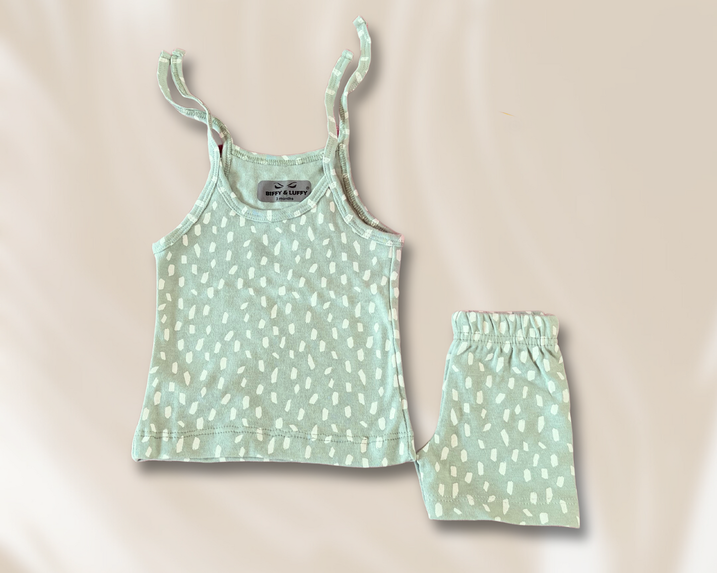 White prints on green kidswear set